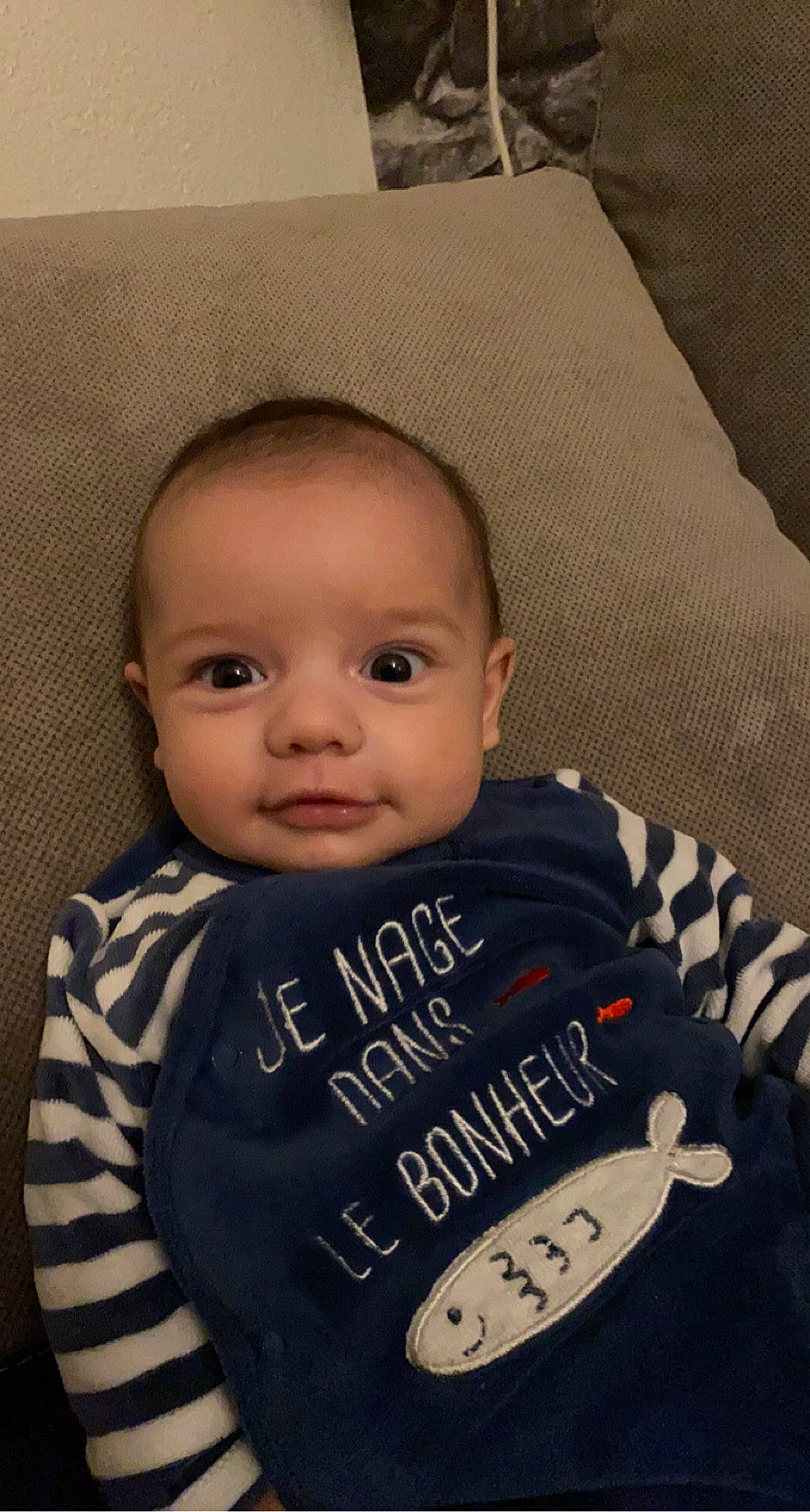 Andria participe au concours pour gagner de l'argent avec cette photo : baby, baby_products, baby_toddler_clothing, cheek, child, comfort, cool, eyebrow, face, home_accessories, iris, linens, lip, person, skin, sleeve, textile, toddler