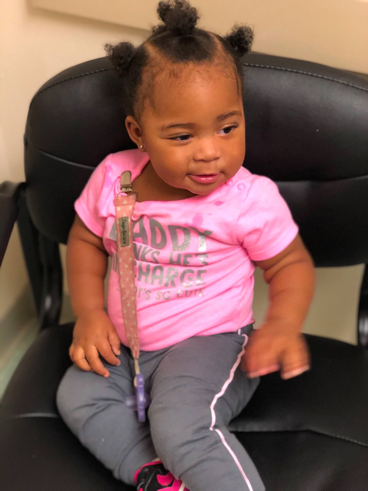 Maliah is registered to the contest to win money with this photo: arm, baby, car_seat, chair, cheek, child, ear, face, games, head, leg, neck, person, pink, sitting, skin, smile, toddler, vacation
