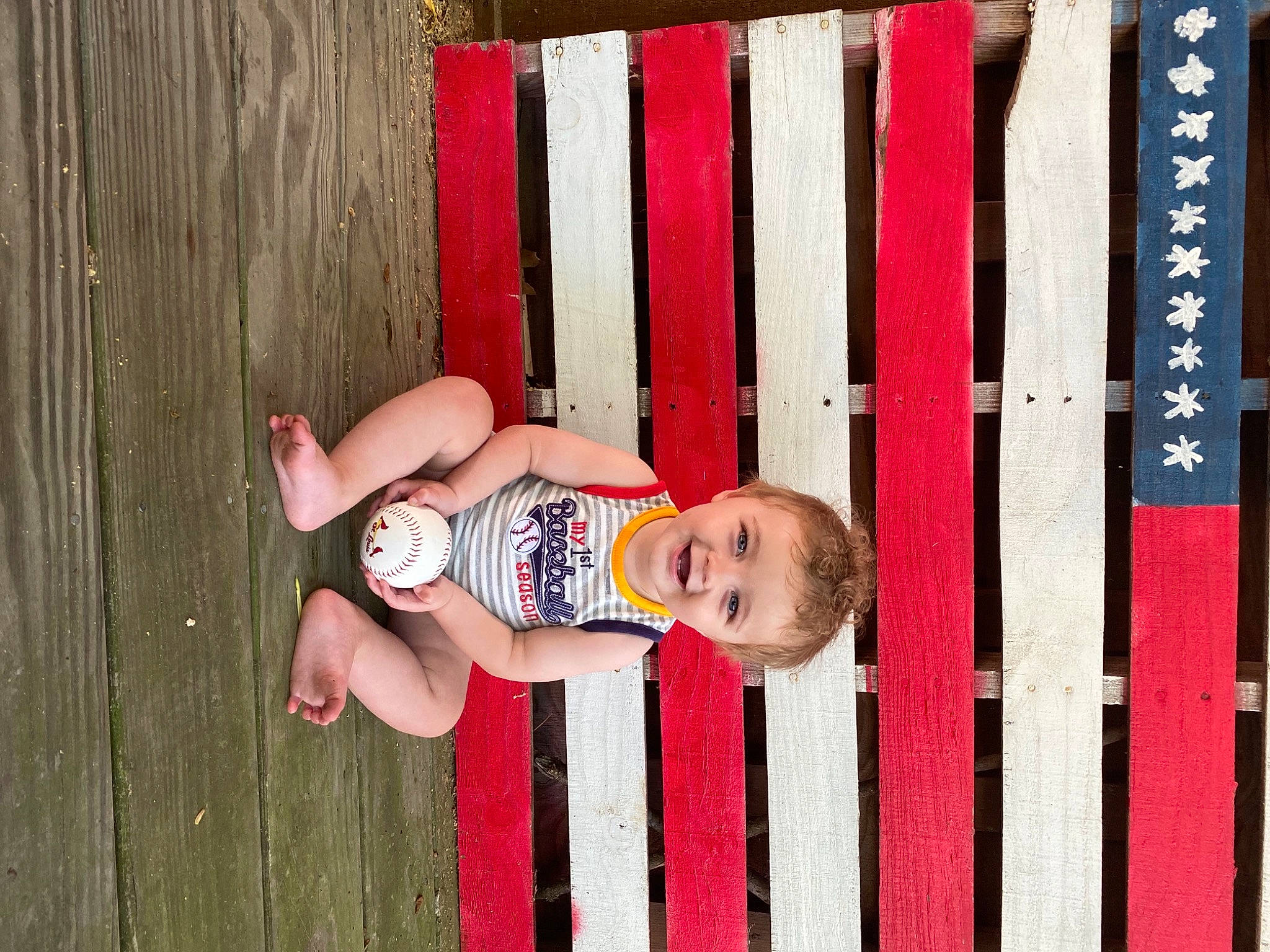 Maxton is registered to the contest to win money with this photo: baby, baby_safety, baby_toddler_clothing, child, eye, face, fence, fun, grass, happy, head, joy, magenta, person, pink, plant, red, smile, toddler, tree