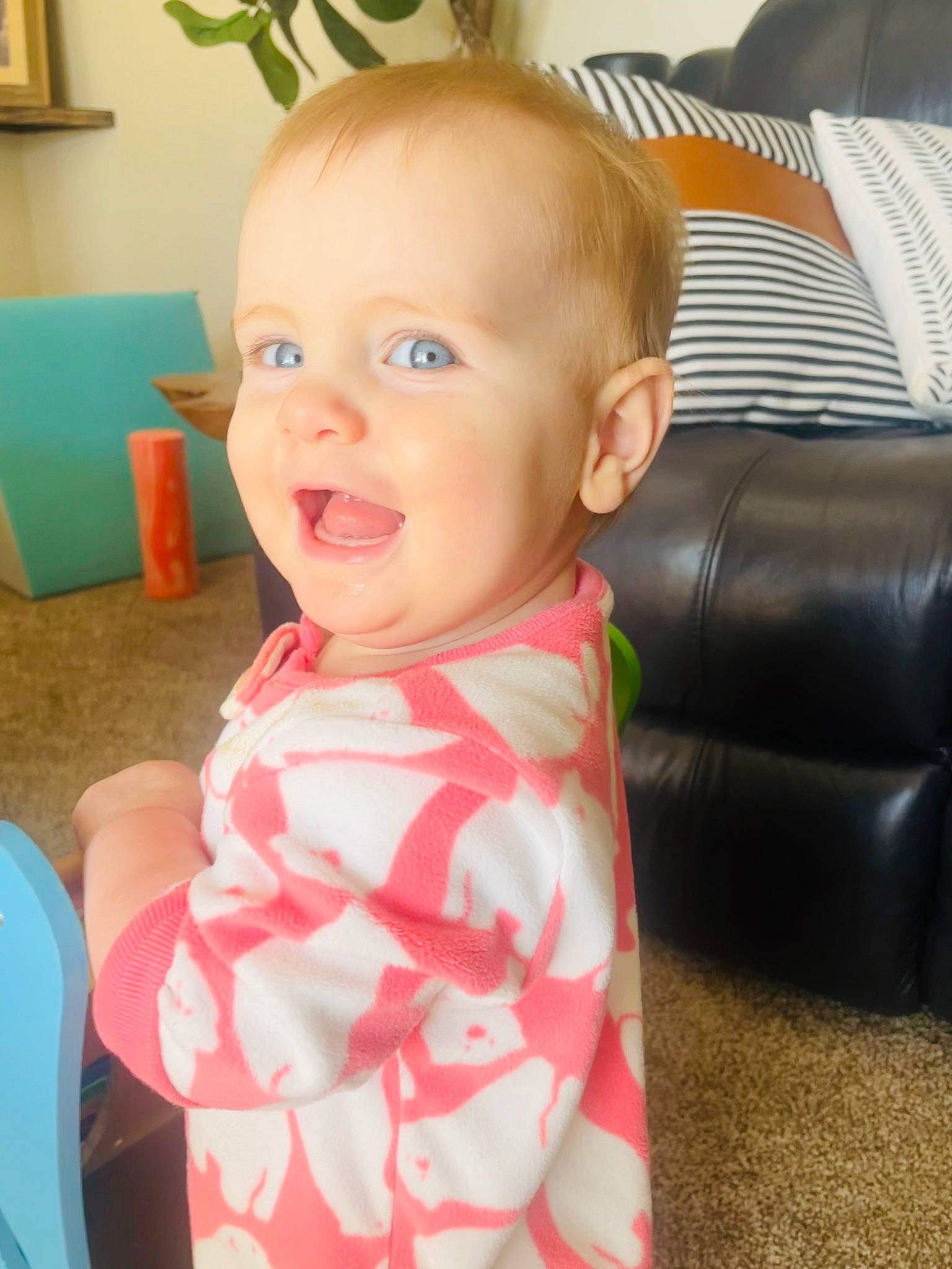 Ivy is registered to the contest to win money with this photo: baby, baby_products, baby_toddler_clothing, car_seat, chair, cheek, child, comfort, couch, flooring, fun, happy, houseplant, living_room, pattern, person, picture_frame, room, sitting, smile