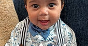 Grayson joined the competition — help win amazing prizes! baby, child, smiling, face, bow_tie, shirt, suspenders, couch, indoors, celebration, holiday, easter, text_overlay, cute, portrait, happy, young_child, clothing, sitting, hands