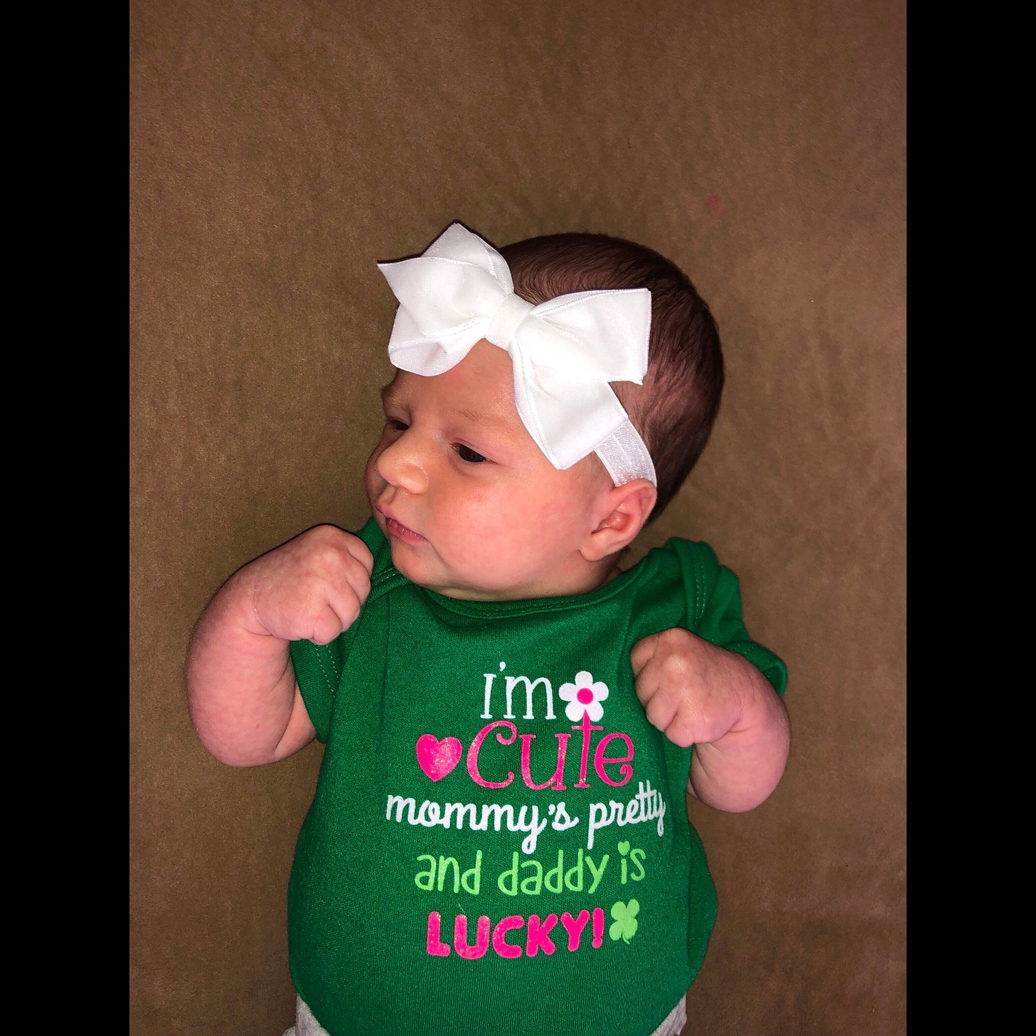 Lillyann is registered to the contest to win money with this photo: baby, baby_toddler_clothing, cheek, child, clothing, cool, ear, green, hand, happy, hat, head, headgear, mouth, outerwear, person, photo_caption, product, skin, sleeve