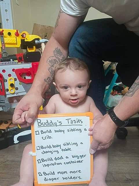 Buddy is registered to the contest to win money with this photo: baby, child, engineering, event, finger, font, fun, hairstyle, hand, handwriting, nail, people, person, photo_caption, product, sitting, snapshot, thumb, toddler, toy