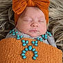 baby, newborn, sleeping_baby, infant, headband, bow, orange_bow, swaddle, blanket, faux_fur, turquoise_jewelry, necklace, jewelry, closeup, portrait, peaceful, skin, lips, soft_texture, decorative_stones