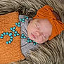 Maisley is registered to the contest to win money with this photo: baby, newborn, sleeping, headband, bow, orange_headband, turquoise_necklace, necklace, blanket, knit_blanket, fur_rug, fur_texture, swaddle, portrait, peaceful, cute, infant, closeup, accessory, soft_lighting