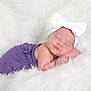 baby, newborn, infant, sleeping, headband, bow, purple_wrap, white_blanket, fluffy, studio_photo, portrait, rosy_cheeks, peaceful, cozy, soft_texture, hand, closed_eyes, sleeping_pose, newborn_photography, cute