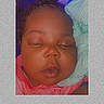 Ayanna is registered to the contest to win money with this photo: baby, sleeping, infant, portrait, face, eyes_closed, peaceful, blanket, clothing, pink_clothing, soft_lighting, indoor, close_up, resting, head, hair, nose, mouth, photograph, cozy