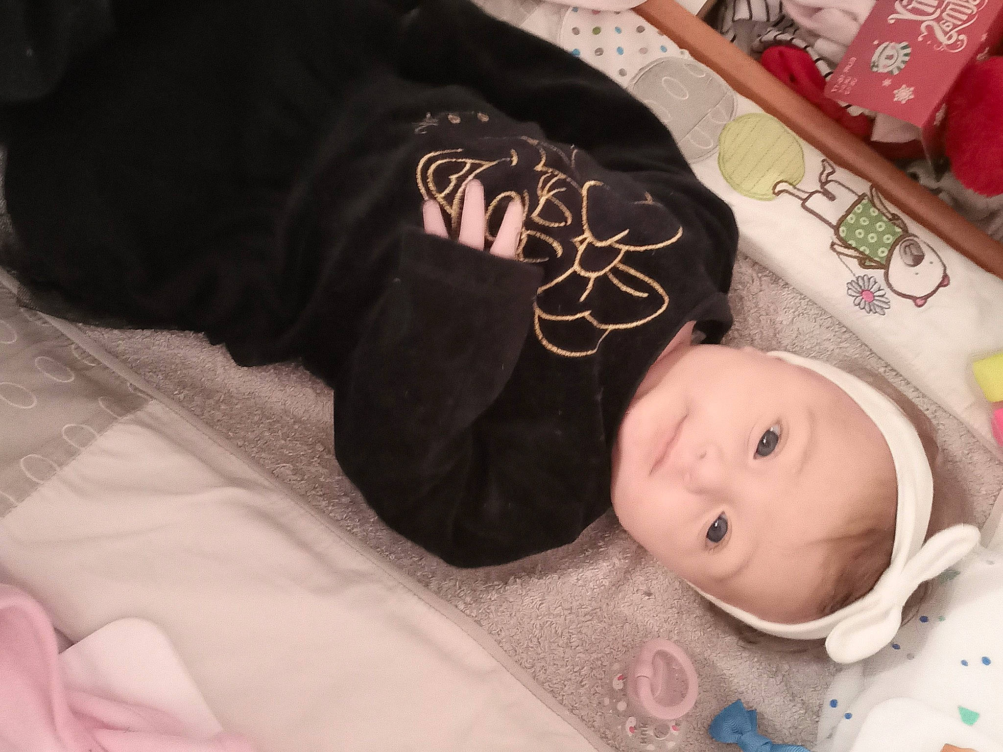 Letty participe au concours pour gagner de l'argent avec cette photo : baby, baby_products, baby_toddler_clothing, cheek, child, comfort, comfort_food, doll, fur, hat, headgear, linens, pattern, person, room, sitting, sleep, sleeve, textile, toddler