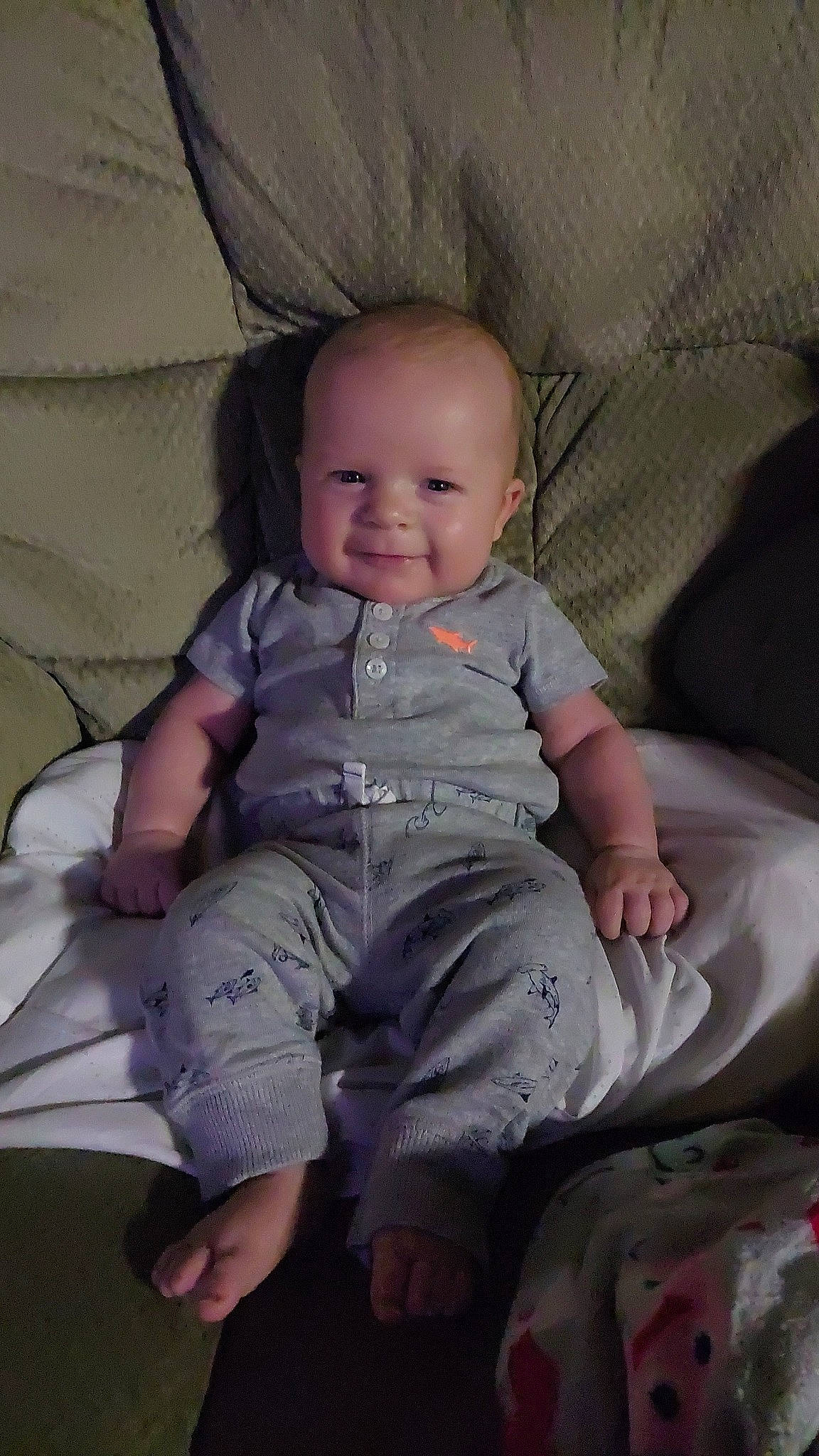 Brayden is registered to the contest to win money with this photo: baby, baby_toddler_clothing, barefoot, cheek, child, comfort, couch, foot, fun, grass, happy, joy, lap, linens, person, pink, sitting, skin, sleeve, smile