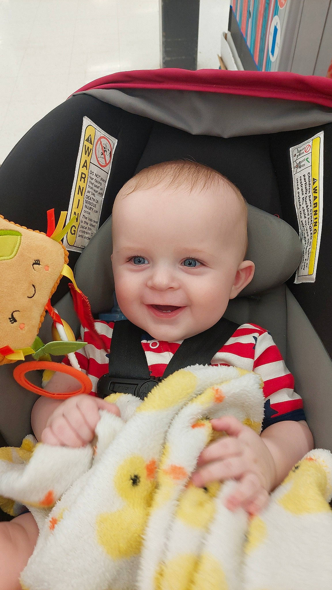 Brayden is registered to the contest to win money with this photo: baby, baby_products, baby_toddler_clothing, child, eye, face, fashion_accessory, fun, happy, head, headgear, joy, orange, person, product, skin, smile, textile, thumb, toddler