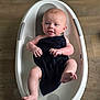 Leo is registered to the contest to win money with this photo: baby, bathtub, towel, water, infant, child, floor, skin, arm, leg, foot, head, face, expression, indoor, nuby, bath, cute, sitting, human