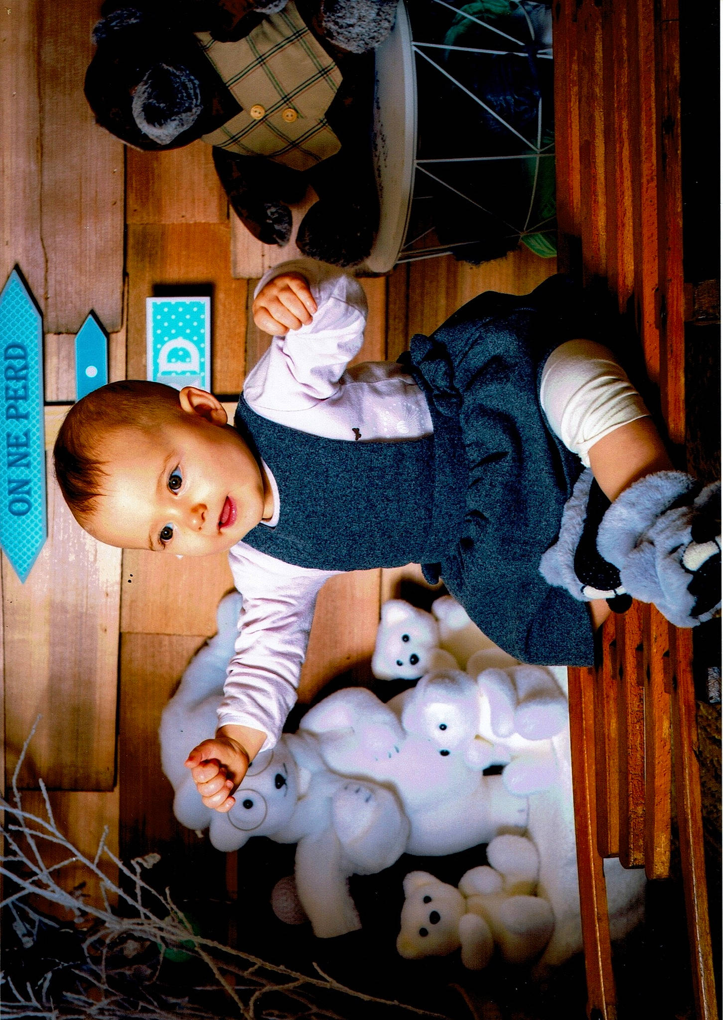 Chloé a rejoint le concours — aidez-le/la à gagner de superbes lots ! art, baby, baby_products, baby_toddler_clothing, cheek, child, doll, flash_photography, fun, happy, hat, pattern, person, room, sitting, sock, toddler, toy, wood