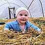 baby, infant, child, smiling, straw, hay, greenhouse, tunnel, beanie, pacifier, crawling, ground, portrait, cute, outdoor, farm, grass, eyes, hands, happy