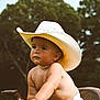 Duke joined the competition — help win amazing prizes! baby, bare_chested, boots, candid, child, cowboy_hat, cute, diaper, grass, hat, nature, outdoor, playful, portrait, saddle, summer, sunlight, toddler, trees, young_child
