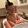 toddler, bath, bathtub, child, hair, spiky_hair, bubbles, kitchen, sink, faucet, water, skin, expression, funny, indoor, cabinet, countertop, person, playful, cute