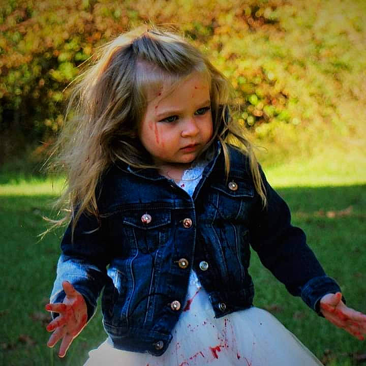 Taylynn is registered to the contest to win money with this photo: baby_toddler_clothing, beauty, blond, brown_hair, child, clothing, eye, grass, hair, happy, jacket, lip, meadow, people_in_nature, person, plant, sleeve, sunlight, toddler, tree