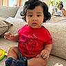 Emmanuel joined the competition — help win amazing prizes! toddler, child, baby, indoor, couch, curly_hair, red_shirt, blue_socks, toy, colorful, woman, flowers, living_room, window, curtains, portrait, seated, casual, home, family