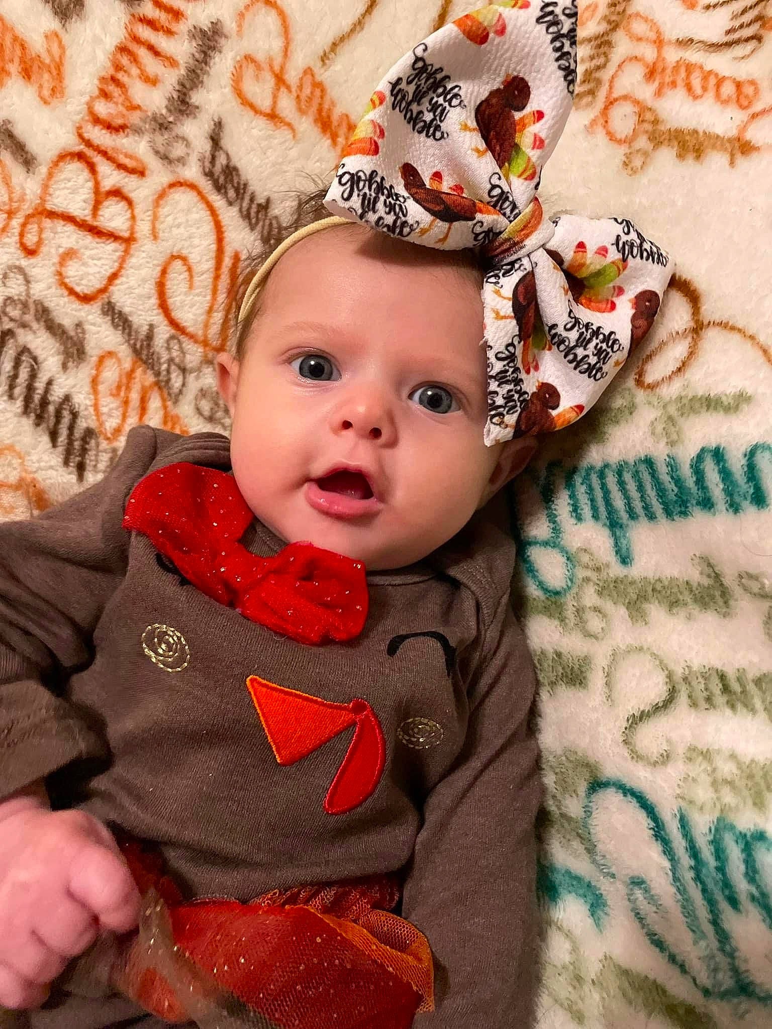 Wrenlee joined the competition — help win amazing prizes! baby, baby_toddler_clothing, cap, child, christmas, costume_hat, fashion_accessory, fur, happy, headband, headgear, headpiece, jewellery, orange, pattern, person, pink, skin, sleeve, surprise