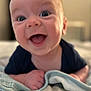 Glenn is registered to the contest to win money with this photo: baby, smiling, happy, infant, blanket, face, skin, person, cute, child, indoors, portrait, young, expression, joy, toddler, hand, clothing, head, closeup