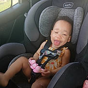 Cori-Christine is registered to the contest to win money with this photo: toddler, child, car_seat, car_interior, smiling, happy, toy, seatbelt, clothing, window, sunlight, headrest, safety, baby, seat, person, vehicle, fun, cute, playful