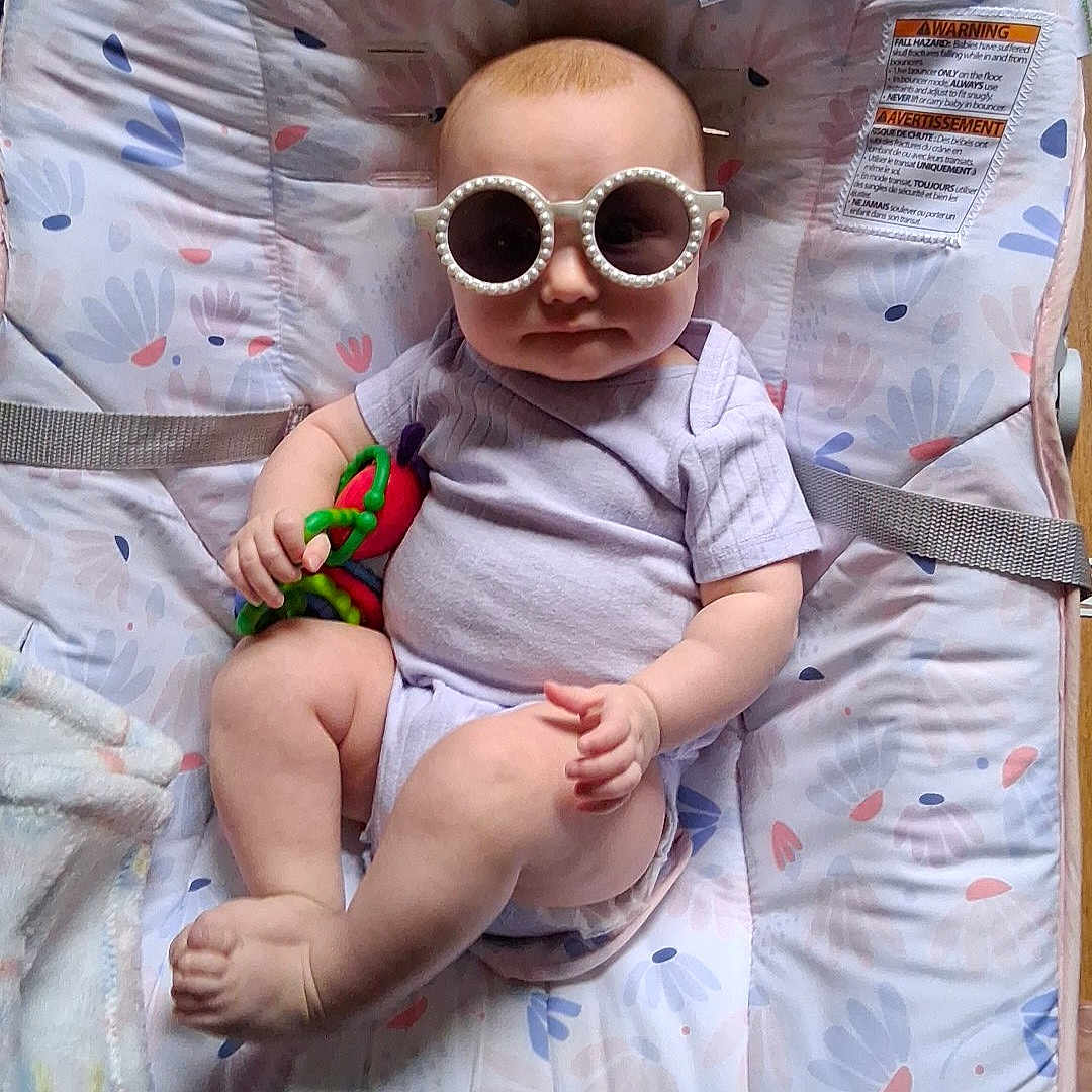 Evalynn joined the competition — help win amazing prizes! accessories, baby, bed, clothing, crib, diaper, face, furniture, glasses, head, homedecor, infantbed, newborn, person, photography, portrait, quilt, shorts, sunglasses, t_shirt