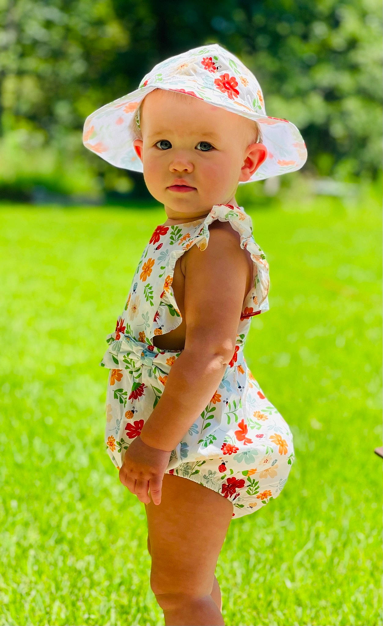 Lakyn joined the competition — help win amazing prizes! baby, baby_toddler_clothing, cap, child, clothing, dress, grass, green, happy, head, headwear, leaf, people_in_nature, person, photograph, plant, red, skin, sleeve, summer