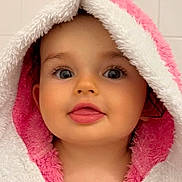 Honoria participe au concours pour gagner de l'argent avec cette photo : baby, child, towel, bunny_ears, pink, white, cute, face, tongue_out, blue_eyes, bathroom, hooded_towel, soft_texture, portrait, skin, head, expression, indoor, person, adorable