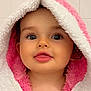 baby, child, towel, bunny_ears, pink, white, cute, face, tongue_out, blue_eyes, bathroom, hooded_towel, soft_texture, portrait, skin, head, expression, indoor, person, adorable