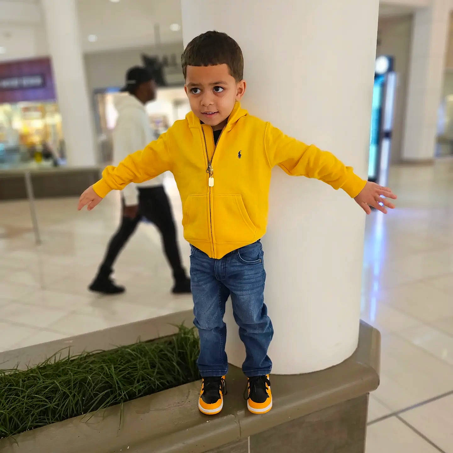 Raphael Manuel is registered to the contest to win money with this photo: child, cleanliness, electric_blue, floor, flooring, fun, gas, gesture, happy, jeans, leg, leisure, person, play, recreation, sleeve, smile, sneakers, standing, sweatpant