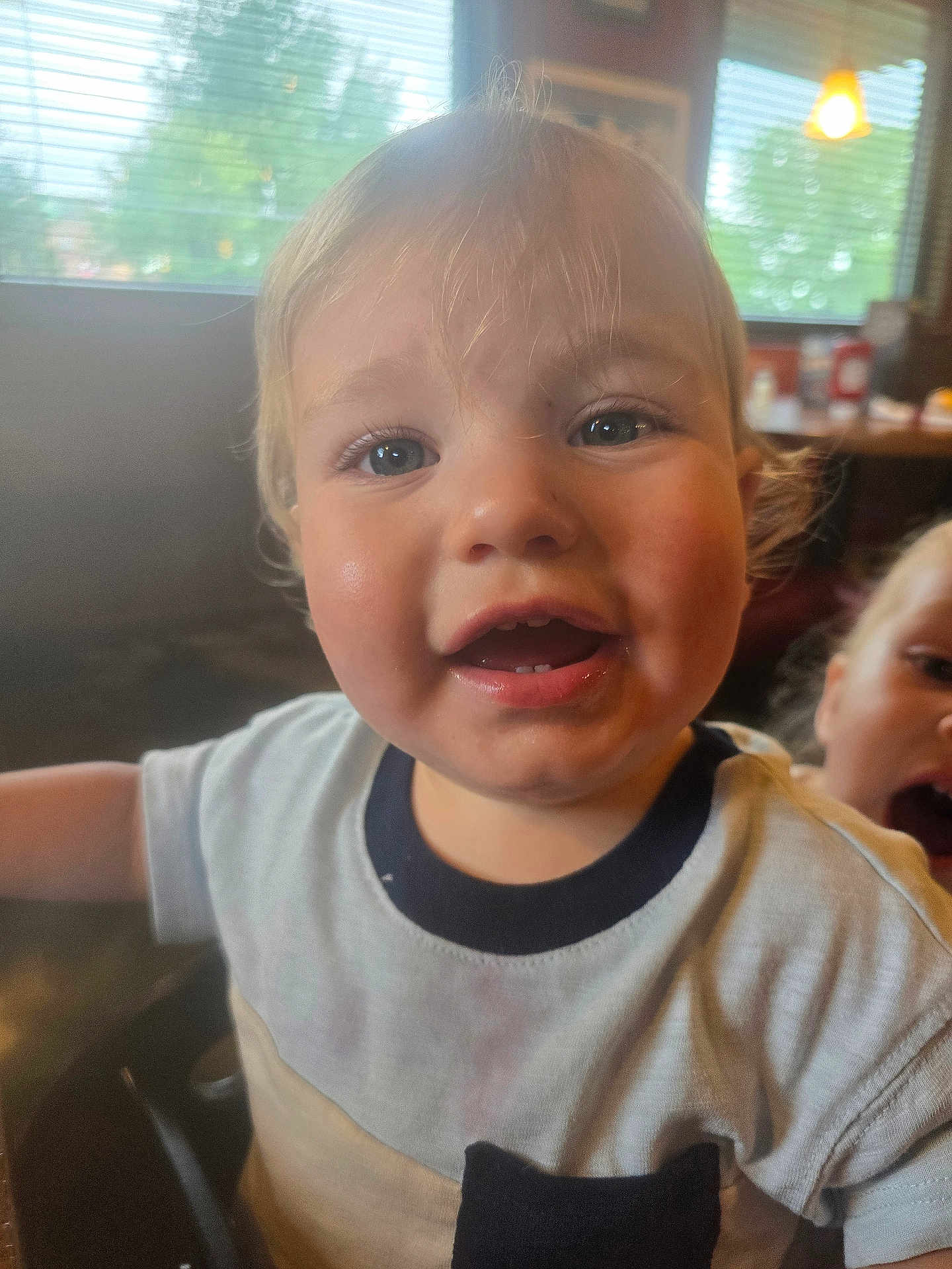 Spencer joined the competition — help win amazing prizes! toddler, child, close_up, indoor, happy, smiling, light, shirt, blonde_hair, face, window, blinds, background, people, portrait, expression, curly_hair, playful, young, two_children