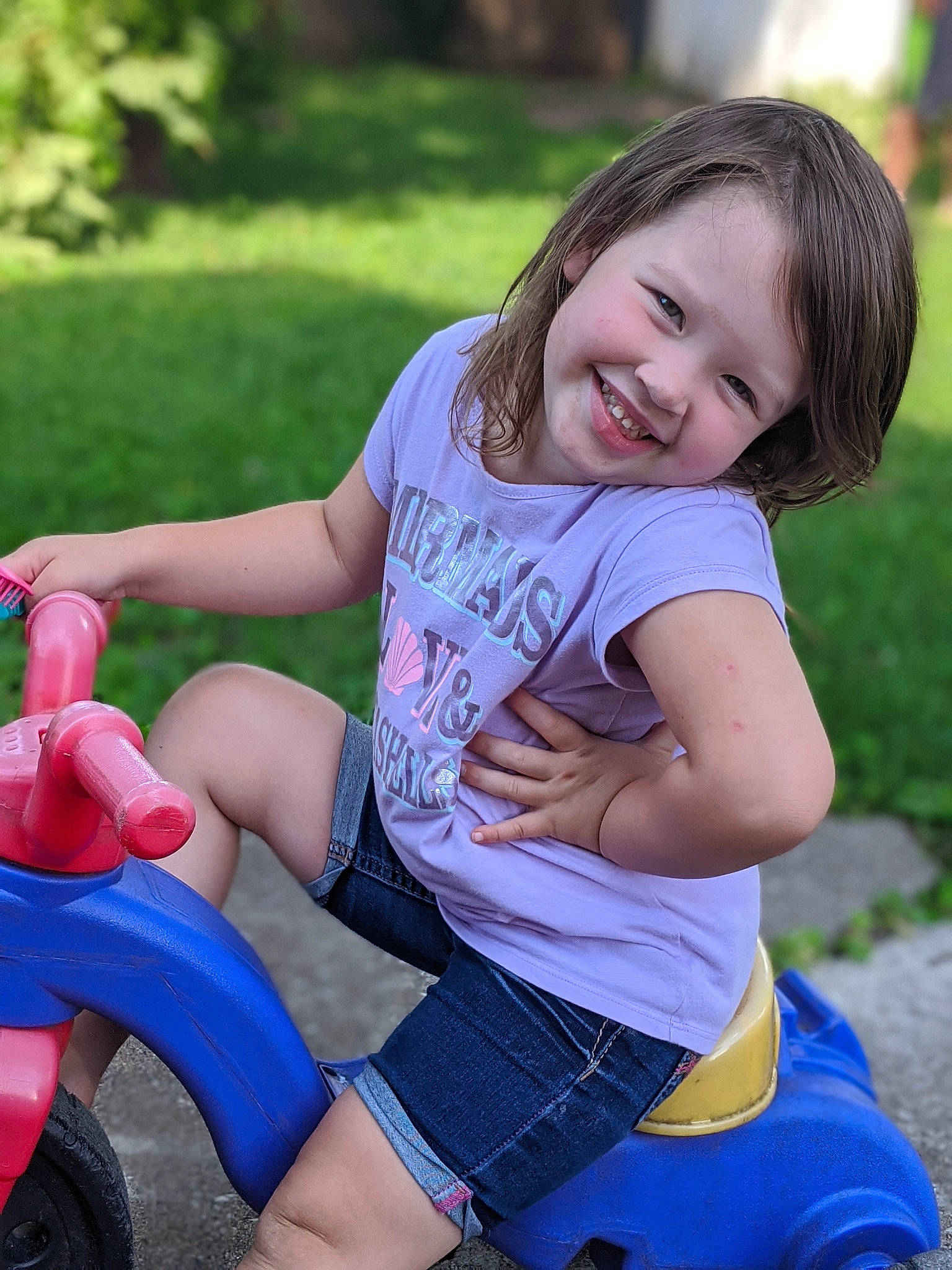Kiley joined the competition — help win amazing prizes! beauty, child, fun, grass, happy, joy, leg, leisure, person, pink, plant, play, playground, public_space, recreation, sitting, skin, smile, summer, thigh