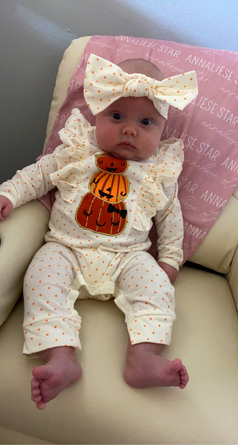 Annaliese is registered to the contest to win money with this photo: baby, baby_toddler_clothing, cheek, child, comfort, costume_hat, doll, eye, face, fur, hat, headwear, linens, pattern, peach, person, pink, sitting, skin, sleeve