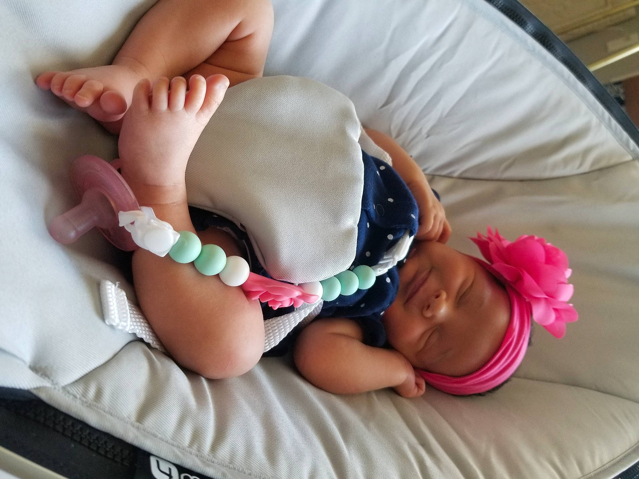 Teal is registered to the contest to win money with this photo: arm, baby, baby_sleeping, barefoot, birth, child, comfort, diaper, finger, foot, hand, headwear, leg, person, play, sole, thigh, toddler, toe