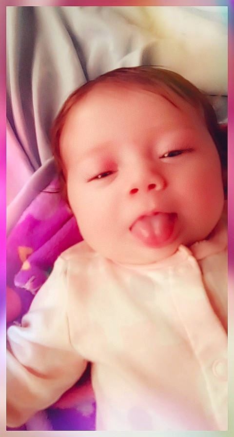 Jayleigh La'Chell Faith Cummings is registered to the contest to win money with this photo: baby, baby_toddler_clothing, cheek, chin, close_up, comfort, eyebrow, eyelash, happy, iris, lip, magenta, mouth, nose, pattern, person, pink, skin, smile, thumb