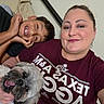 woman, boy, child, dog, pet, family, selfie, portrait, smiling, happy, tongue_out, indoors, bedroom, bed, clothing, t_shirt, maroon, braces, long_hair, companionship