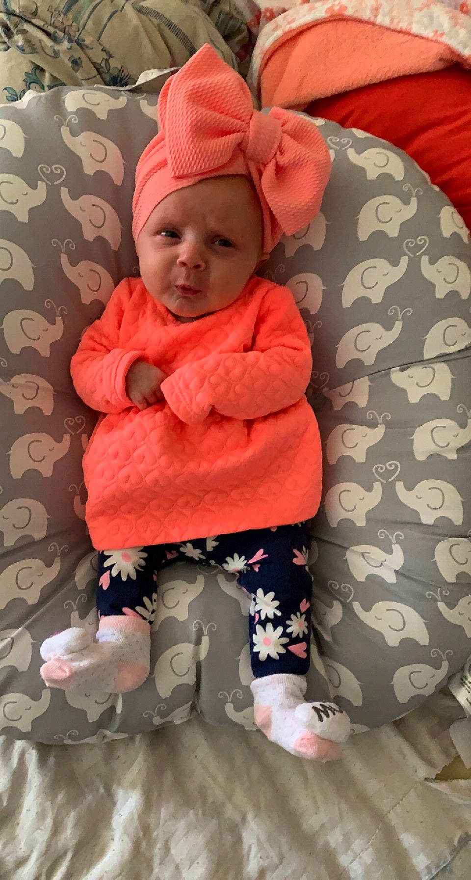 Korah is registered to the contest to win money with this photo: baby, baby_sleeping, baby_toddler_clothing, cap, cheek, child, comfort, face, glasses, headgear, headwear, jacket, knit_cap, linens, magenta, pattern, person, pink, skin, sleeve