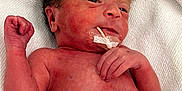 Eliana joined the competition — help win amazing prizes! newborn, baby, infant, blanket, hospital, feeding_tube, medical, skin, face, hand, lying_down, person, cute, small, resting, healthcare, child, bed, white, towel