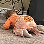 baby, crawling, pajamas, pumpkin, orange, striped_clothing, carpet, indoor, child, floor, socks, blur, exploration, cute, toddler, home, furniture, metal_frame, carpeted_floor, infant