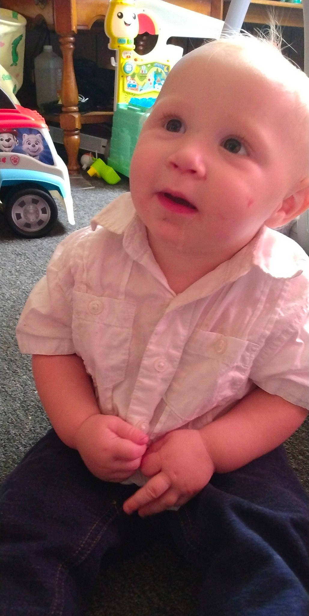 Justin is registered to the contest to win money with this photo: automotive_tire, baby, baby_toddler_clothing, cheek, child, chin, fun, hairstyle, happy, lip, motor_vehicle, nose, person, pink, skin, sleeve, thumb, tire, toddler, vehicle