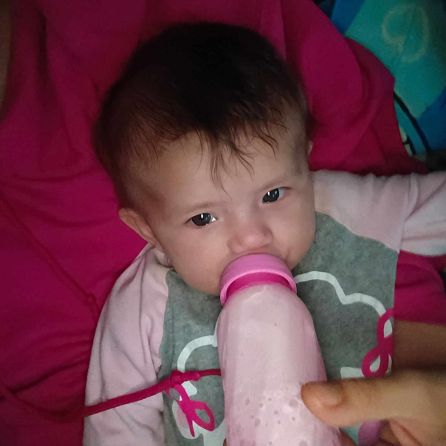 Roseley joined the competition — help win amazing prizes! baby, blanket, bottle, child, closeup, clothing, cute, drink, expression, face, feeding, hand, indoor, infant, lying_down, person, pink, portrait, toddler, young_child