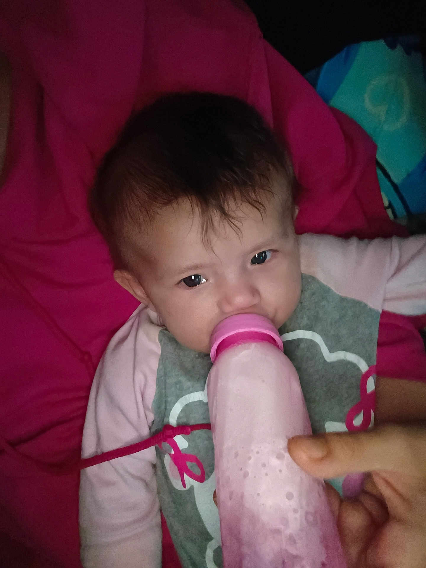 Roseley joined the competition — help win amazing prizes! baby, bottle, feeding, pink, blanket, child, hand, clothing, face, portrait, infant, cute, toddler, lying_down, indoor, person, young_child, drink, closeup, expression