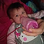 baby, bottle, feeding, infant, hand, clothing, blanket, pink, grey, animal_print, cute, indoors, child, person, young, portrait, lying_down, feeding_bottle, close_up, tender_moment