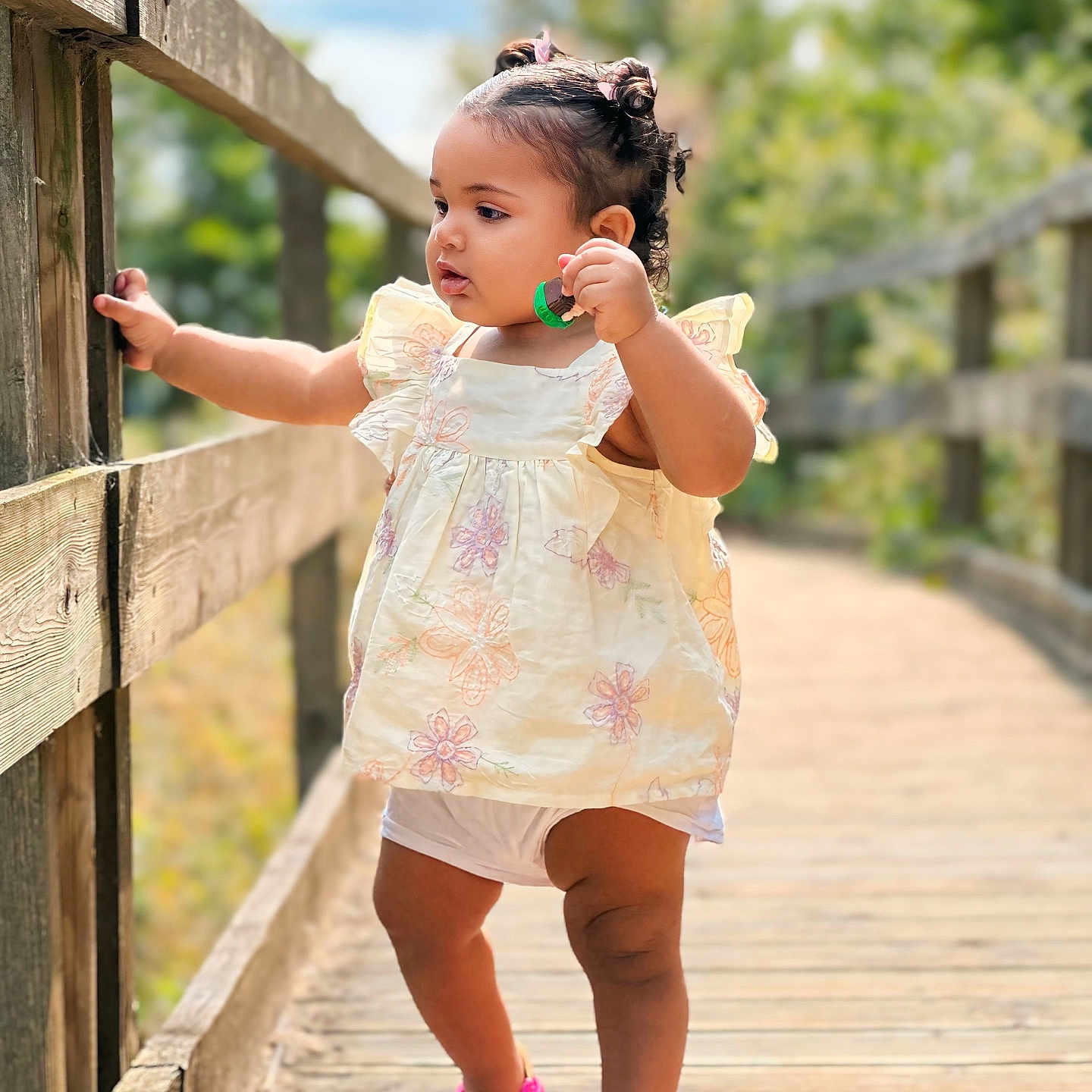 Zaiyla May is registered to the contest to win money with this photo: boardwalk, bridge, child, clothing, dress, face, female, girl, head, path, person, photography, pier, portrait, shorts, walking, walkway, water, waterfront, wood