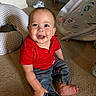 baby, child, smiling, indoor, carpet, red_shirt, denim_pants, happy, person, toddler, floor, toys, baby_gear, candid, cute, infant, sitting, face, portrait, home