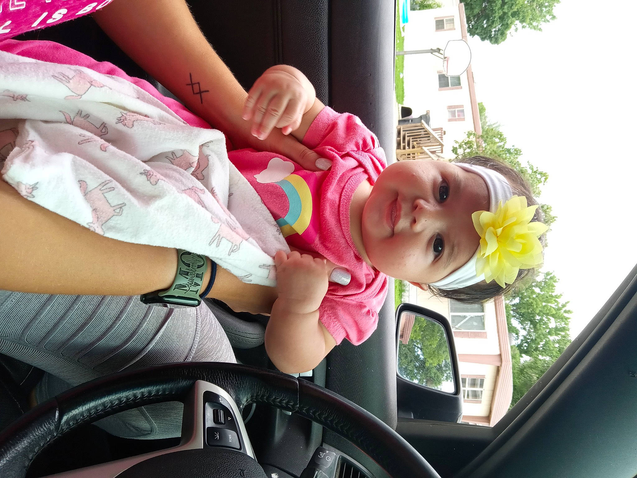 Dannika joined the competition — help win amazing prizes! automotive_design, automotive_lighting, automotive_mirror, car, dress, eyewear, finger, glasses, green, hand, headwear, jeans, motor_vehicle, person, pink, plant, rear_view_mirror, steering_wheel, sunglasses, tree