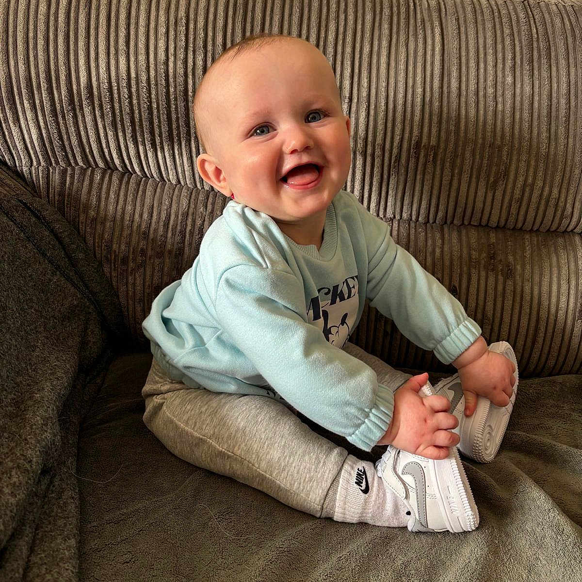 Grayson joined the competition — help win amazing prizes! baby, babylaughing, clothing, couch, cushion, face, furniture, happy, head, homedecor, jeans, laughing, pants, person, photography, portrait, sitting, sleeve, smile
