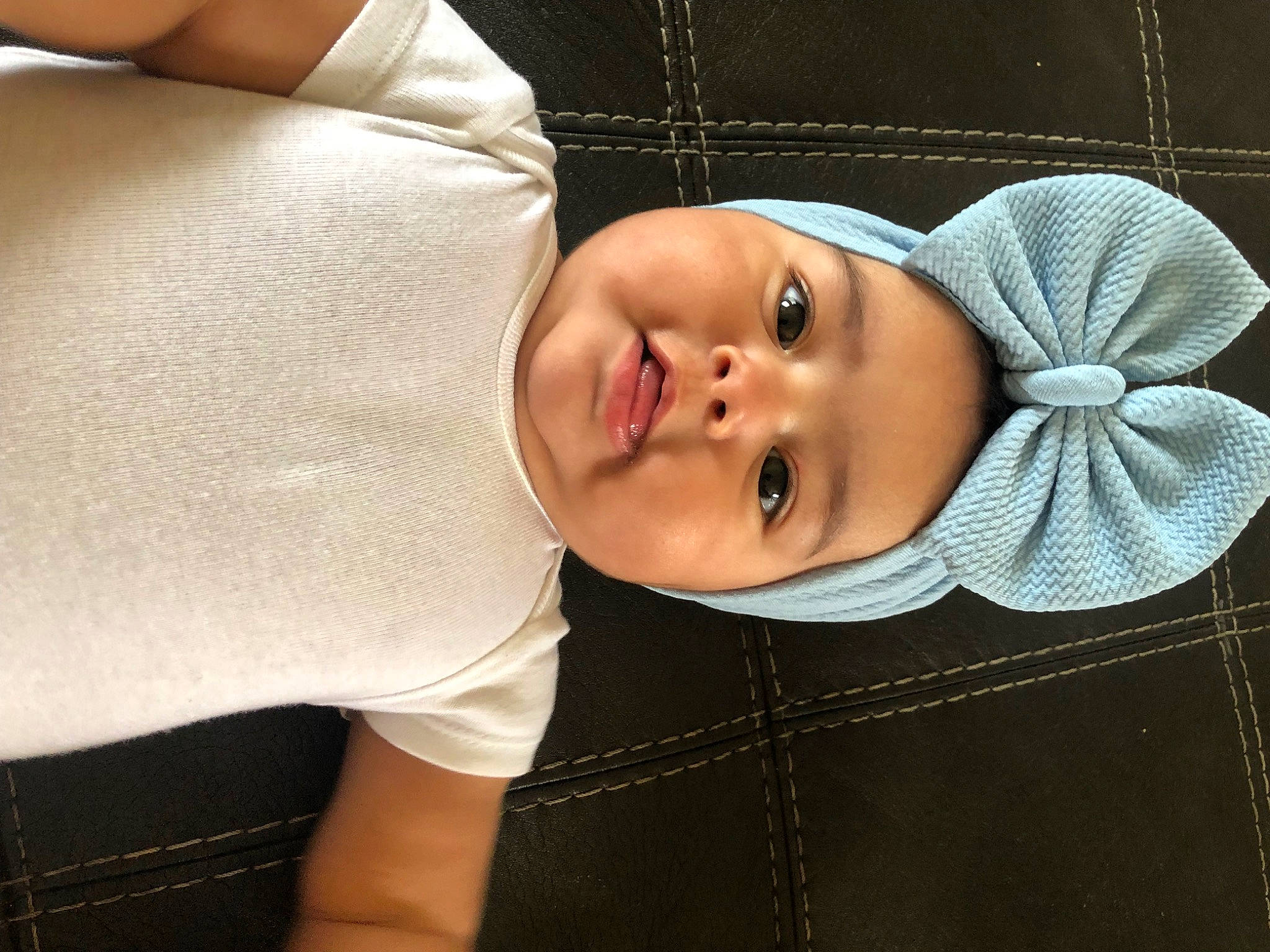 Iliana is registered to the contest to win money with this photo: baby, baby_products, baby_toddler_clothing, button, cheek, child, collar, comfort, eye, hat, head, headwear, linens, lip, pattern, person, polar_fleece, portrait_photography, sleeve, smile