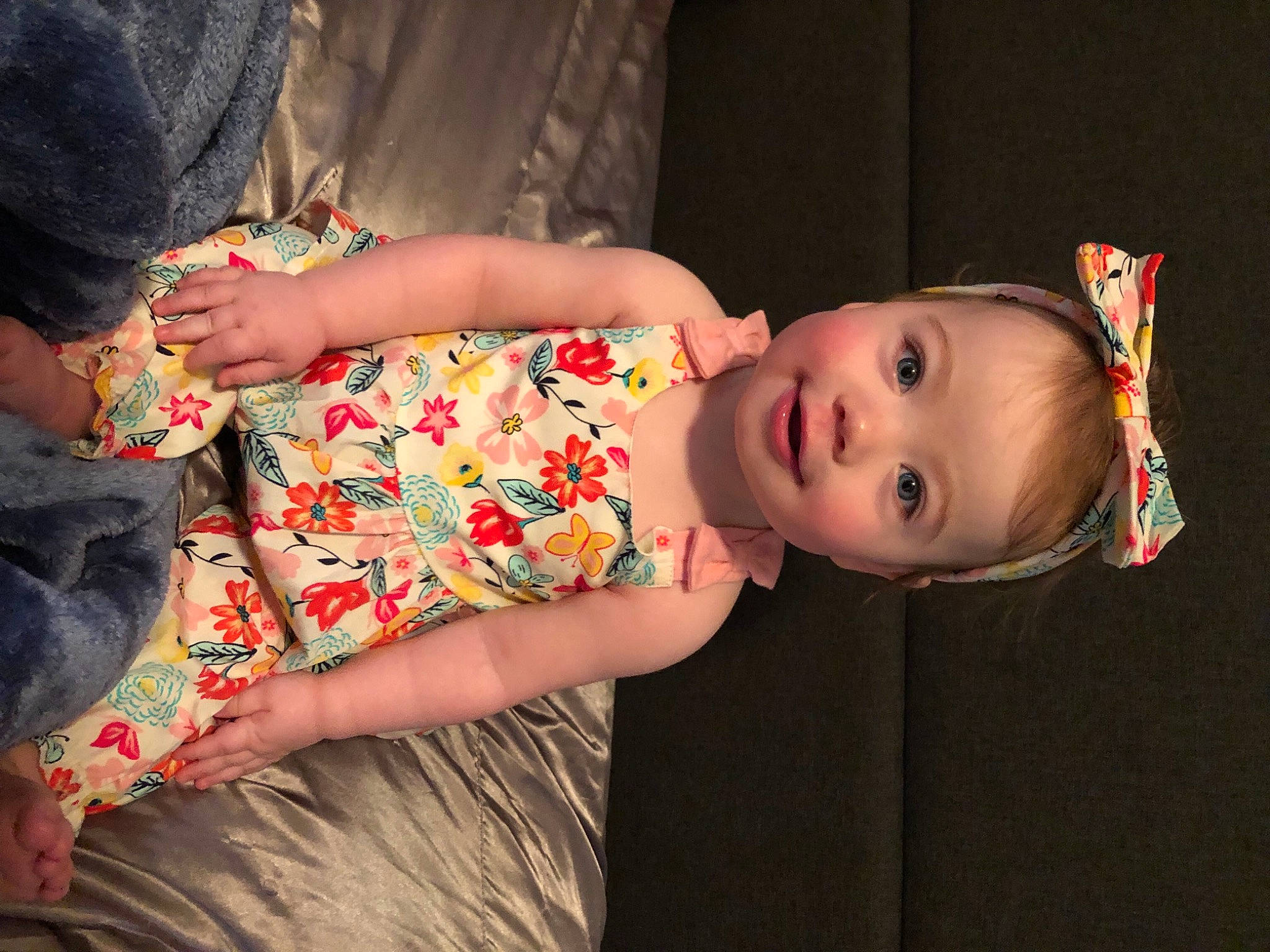 Marlie is registered to the contest to win money with this photo: baby_toddler_clothing, cheek, child, dress, event, flash_photography, fun, happy, human_body, human_leg, iris, mouth, nose, person, sitting, skin, textile, thigh, toddler, tradition