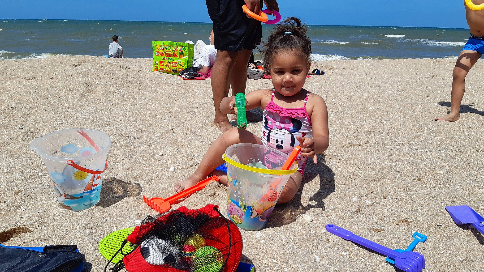 Nadya participe au concours pour gagner de l'argent avec cette photo : beach, blue, event, fun, happy, human, joy, leisure, mammal, natural_environment, people_on_beach, person, photograph, recreation, sand, shorts, sky, summer, toddler, travel