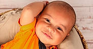 William joined the competition — help win amazing prizes! baby, basket, child, comfort, cushion, cute, face, happy, head, indoors, infant, orange_clothing, person, portrait, relaxed, resting, skin, smile, toddler, young